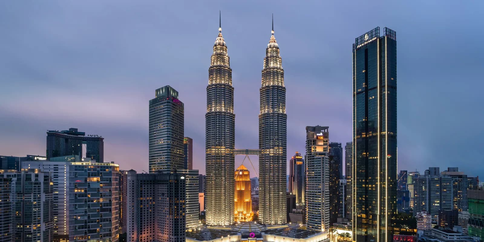 Petronas Towers lit up above Kuala Lumpur