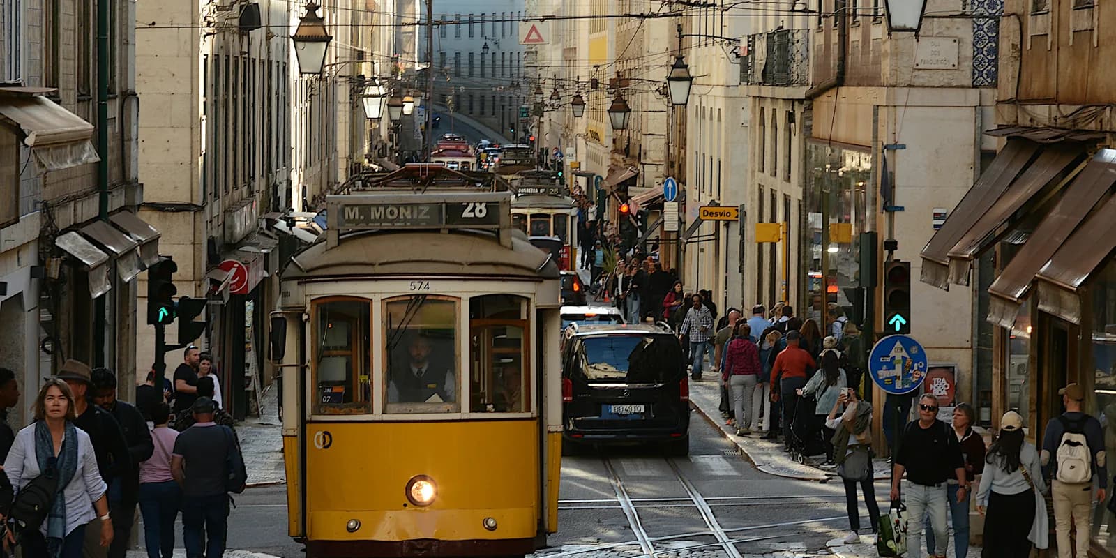 Lisbon's historic Tram 28 climbing through Alfama