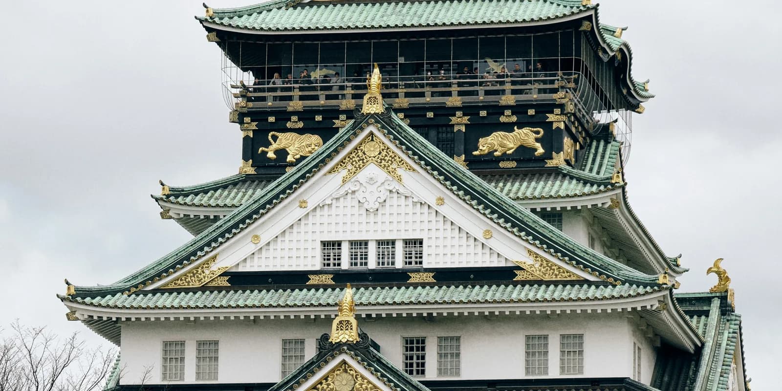 Osaka Castle's traditional rooflines and gold details