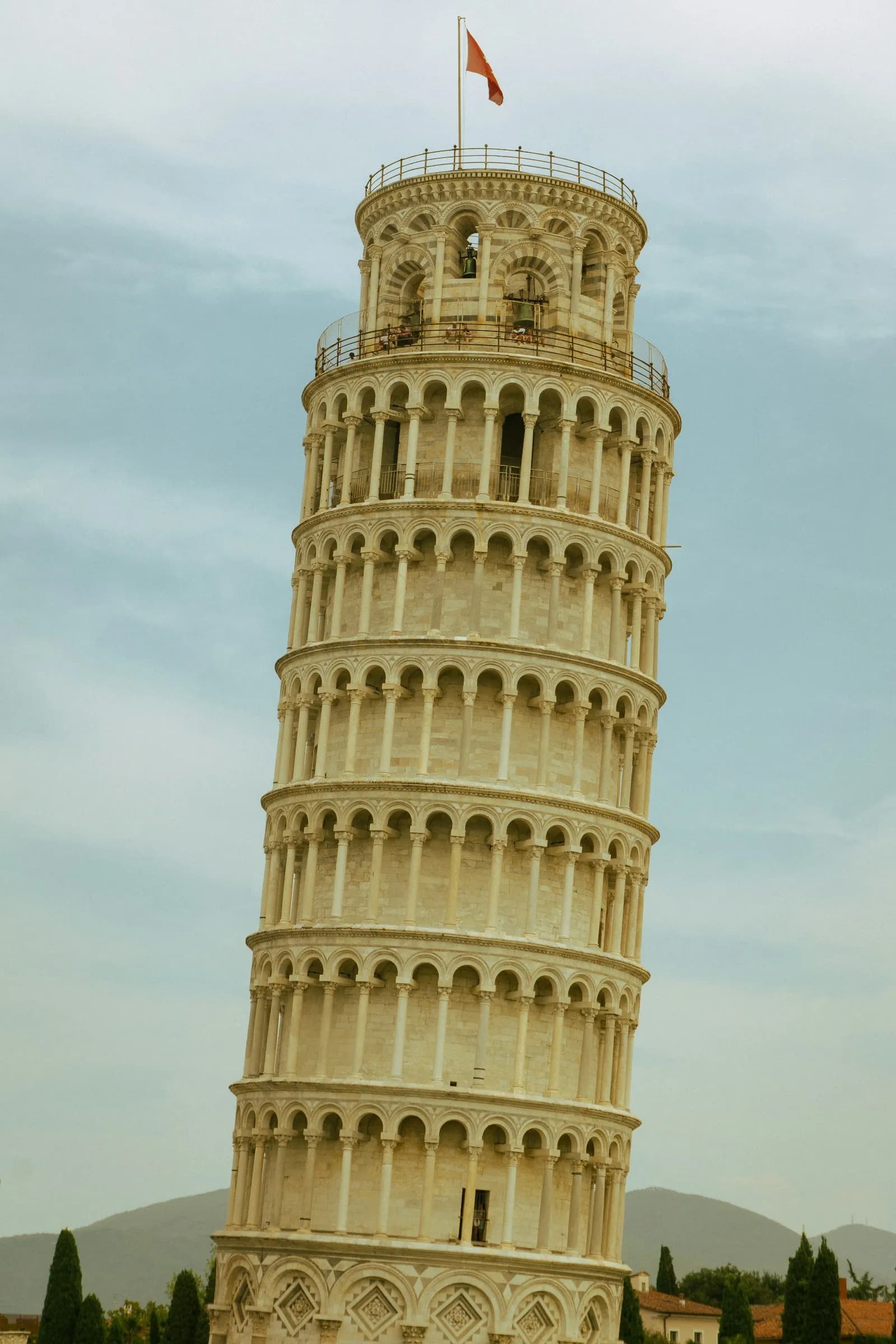 The Leaning Tower of Pisa against a cloudy sky
