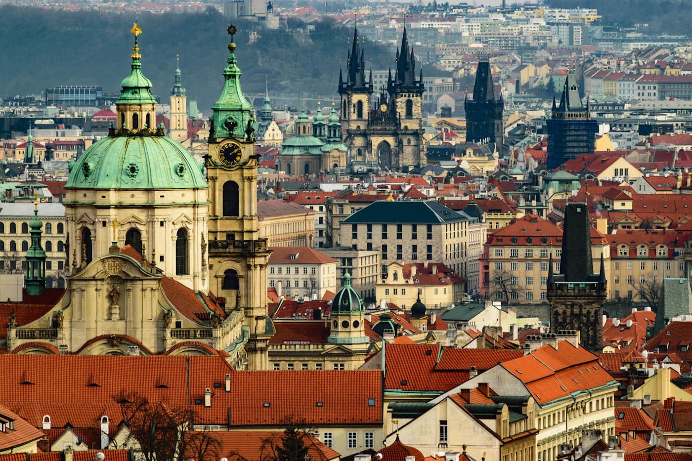 Colourful rooftops and river bridges across Prague's historic centre