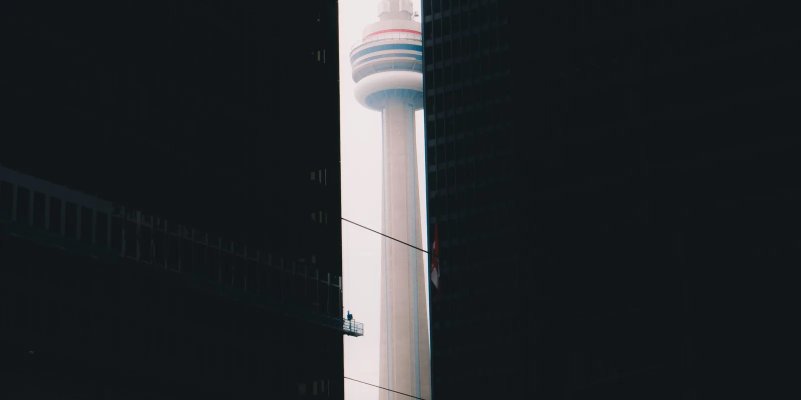Toronto's CN Tower rising between downtown high-rises
