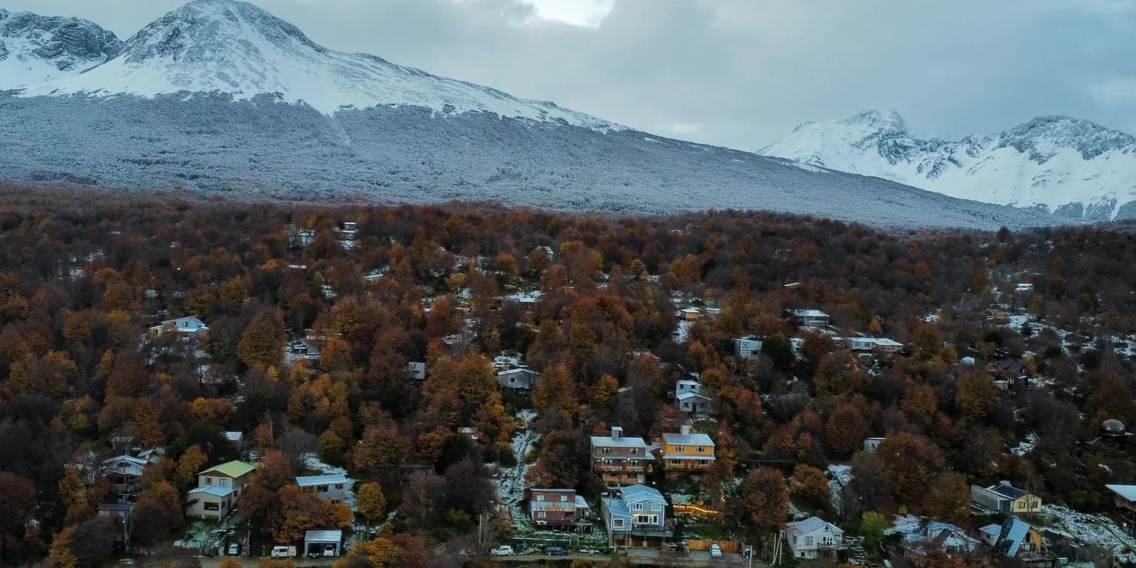 Ushuaia neighbourhoods beneath snow-covered Patagonian mountains
