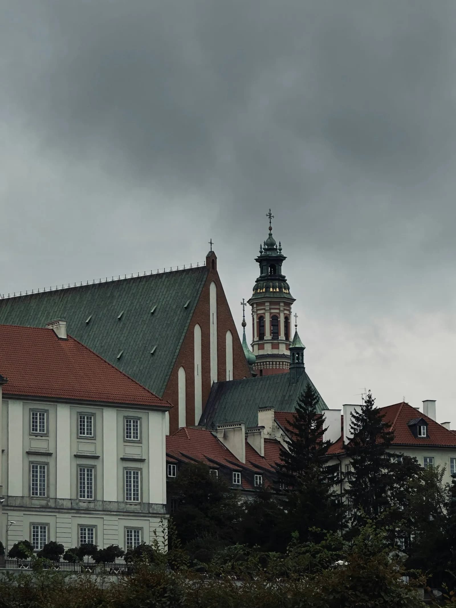A pale clock-tower façade in Warsaw's Old Town